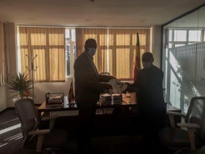 Minister of State for Livestock Development of Ethiopia's Ministry of Agriculture receives the Mastitis training materials