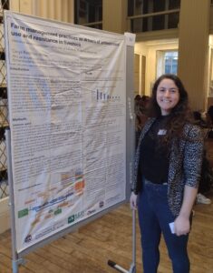 Carys Redman-White presents a research poster.
